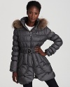 A tulip hem and waist-cinching belt lend feminine charm to this Dawn Levy down coat, finished with a sumptuous fur-trimmed hood for extra protection from cool winds.