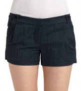 Crinkle-texture adds subtle shine to these trimly tailored shorts. Button-tab details at waist Belt loops Zipper front fly Side slash pockets Back button-flap pockets Back notched waistband Rise, about 2 Inseam, about 9½ 66% nylon/34% cotton; dry clean Imported