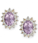 Enhance your look with bold flecks of color. Victoria Townsend's pretty stud earrings feature oval-cut amethyst (2-1/2 ct. t.w.) encircled by round-cut white topaz (1-1/20 ct. t.w.). Set in 18k gold over sterling silver. Approximate diameter: 1/2 inch.