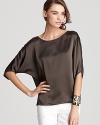 A silk Vince top with envelope-style sleeves exudes effortless chic from morning to night. Topping of staple styles with easy elegance, its rich brown hue proves there's more to life than black.