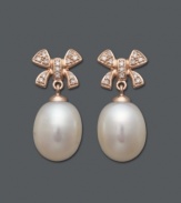 Polished and presentable. Add a touch of femininity to any look with these cultured freshwater pearl (10-11 mm) and diamond-encrusted (1/8 ct. t.w.) bow earrings. Crafted in 14k rose gold. Approximate drop: 1 inch.