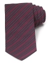 A traditionally striped tie in pure Italian silk lends luxury to your polished wardrobe and can be worn to work or your dressed-up evening affairs.