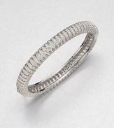 Neat rows of shimmering crystal line up along a slender bangle to wear alone or stack with others.CrystalRhodium platingDiameter, about 2.25Hinged with tongue-and-groove claspImported