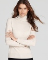 Cozy meets chic as sumptuous wool outfits a sleek Lafayette 148 New York turtleneck.