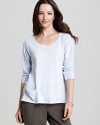 This Eileen Fisher top is rendered in luxe linen with ribbed knit trim and a pocket at the hem for easy access to small belongings.