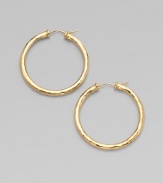 From the Martellato Collection. Graceful hoops with a rich hammered texture in gleaming 18k gold.18k yellow goldDiameter, about 1¾PiercedMade in Italy