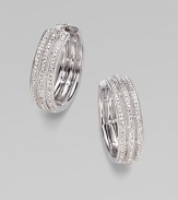 EXCLUSIVELY AT SAKS. A simple yet shimmering design offering three elegant rows of pavé crystal.Crystal Rhodium plated Diameter, about 1 Post-and-hinge back Imported