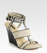 Textured linen t-strap design with leather trim, adjustable ankle straps and a stacked wedge. Stacked wedge, 4 (100mm)Linen and leather upperLeather lining and solePadded insoleImportedOUR FIT MODEL RECOMMENDS ordering true size. 