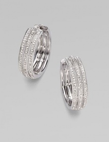 EXCLUSIVELY AT SAKS. A simple yet shimmering design offering three elegant rows of pavé crystal.Crystal Rhodium plated Diameter, about 1 Post-and-hinge back Imported