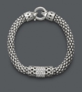 Embrace a little vintage-inspired elegance. This retro bracelet receives a modern touch with a tasteful, thick chain, intricate crisscross pattern, and rows of round-cut diamonds (1/4 ct. t.w.). Crafted in sterling silver. Approximate length: 8-1/2 inches.