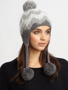 This ultra-soft, ultra-toasty knit hat is crafted in an eye-catching herringbone design with braided straps and pom-poms.Baby alpaca/merino/bambooDry cleanMade in the USA