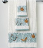 A lovely floral motif in a serene blue and white palette lends an air of nature-inspired sophistication to this Martha Stewart Collection Mariposa hand towel. Fanciful butterflies add delightful pops of color.