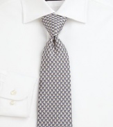 A dog-newspaper print adds a playful touch to this signature Salvatore Ferragamo silk tie.SilkDry cleanMade in Italy