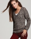 A trend-right marled knit lends depth and texture to this Sam & Lavi sweater.