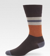 Bold stripes are knitted in a luxurious blend of stretch cotton.Mid-calf height72% cotton/26% nylon/2% spandexMachine washImported