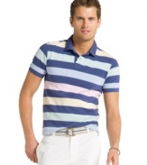 Show your softer side. Get classic bold style with subtle pastel stripes in this polo shirt from Izod.