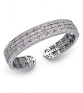 Deck yourself out in diamonds. This exquisite bangle features a cut-out pattern decorated with round-cut diamonds (5/8 ct. t.w.). Set in sterling silver. Approximate diameter 2-1/2 inches.