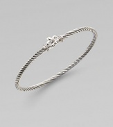 From the Cable Collection. An elegant piece with diamond accents on a sterling silver cable bangle. Sterling silverDiamonds, .08 tcwDiameter, about 2½Slip-on styleImported 