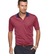 Hit your stride with stripes. Your style will be as solid as your play in this Izod shirt that features moisture wicking and UPF 15 protection for all-day comfort.