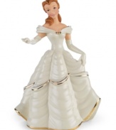 Belle looks radiant as ever in a shimmery dress in this beautiful figurine inspired by the Disney classic Beauty and the Beast. Accented with 24-karat gold and measures 8.