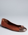 Iconically Delman ballet flats feature metallic cap toes, one of the season's must-have looks.