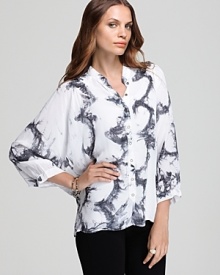 The classic dress shirt gets a contemporary update as sheer styling and abstract tie-dye infuse this XCVI blouse with modern edge.