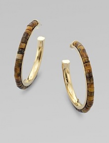 Beautifully textured tiger's eye-inspired beads set into a goldtone hoop for a unique look. Epoxy beadsGoldtone brassLength, about 1¾Post backImported 