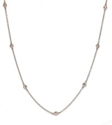 Inch by inch of luminous sparkle. B. Brilliant's delicate necklace features nine round-cut cubic zirconia stations (9/10 ct. t.w.) set in 18k gold over sterling silver. Approximate length: 24 inches.