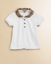 Casual yet chic, this classic top is reinvented with a ruffled check collar.Ruffled check collar Partial front button closure Short sleeves Embroidered logo at the hem Cotton Machine wash Imported Please note: Number of buttons may vary depending on size ordered. 