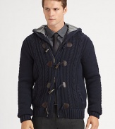 A cozy, wool knit with a nautical-inspired toggle closure for relaxed, yet rustic look.Two-way zip frontToggle button-frontAttached hoodSide slash pocketsRibbed knit cuffs and hemWoolDry cleanImported