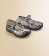 She'll shine like a disco ball in these glitter-adorned Mary Jane flats with adjustable grip-tape closure and rubber sole for supreme comfort.Adjustable grip-tape strapTextile and glitter upperTextile liningRubber solePadded leather insoleImported