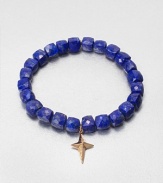 A sparkling diamond charm in 14k gold on a lapis stretch bead bracelet. Lapis14K goldDiamonds, .02 tcwLength, about 6.5Slip-on styleImported 