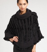 A sophisticated style with luxurious dyed rabbit fur accenting a warm knitted design. Oversized turtleneckCurved hemAbout 35 from shoulder to hem70% acrylic/30% woolSpecialist dry cleanImportedFur origin: China 