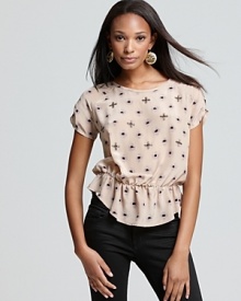 Charming polka dots embellished with beads decorate this whimsical Joie silk top for a most lovely springtime look. Teamed with high-waist denim, the look is a delightful hit any day of the week.