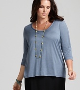 A classic scoop neck flatters the décolleté in this Eileen Fisher basic three-quarter sleeve tee--a must-have for seasonal layering.