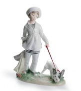 Adorable duo. Looking very nautical in a striped shirt and sailor hat, the little girl in this porcelain collectible is nearly as cute as her French bulldog pup. From Lladro.