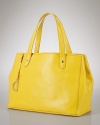 Lauren by Ralph Lauren gives its tried-and-true tote an elegant update with studded details and an embossed logo.