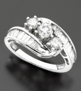 Stunning prong-set diamonds in a ribbon of sparkle. Diamond ring (1-1/2 ct. t.w.) set in 14k white gold.