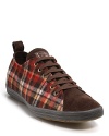 A low-profile sneaker from Paul Smith, centered on a rich plaid upper with leather tongue and toe.