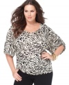 Explore on-trend safari style with MICHAEL Michael Kors' half sleeve plus size peasant top, showcasing an animal print.