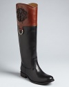 Long and lean, these rich leather boots get the luxe touch with an elegant logo accent and silvery buckle. By Frye.