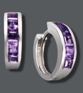 Purple hues give traditional hoops a poignant touch. Set in sterling silver, hoops feature baguette-cut, channel-set amethyst (1-1/2 ct. t.w.). Approximate diameter: 1/2 inch.