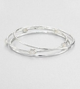 From the Rock Candy® Collection. A trio of hammered, sterling silver bangles accented with faceted mother-of-pearl. Sterling silverMother-of-pearlDiameter, about 2.5Slip-on styleImported 