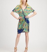 A vibrant print highlights this draped blouson style finished with soft pleats from hip to hem.V necklineDropped shouldersDolman sleevesBlouson bodiceElastic waistbandPleated mock-wrap skirtAbout 22 from natural waistRayonDry cleanMade in USA of imported fabricModel shown is 5'10½ (179cm) wearing US size Small.