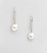 A column of dazzling diamonds set in 18k white gold accent this elegant Akoya pearl drop design. 7.5mm round white Akoya pearlsDiamonds, .08 tcw18k white goldDrop, about 1Lever backImported 