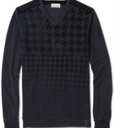 DKNY Jeans takes the traditional houndstooth pattern and the conventional V-neck sweater and turns them into something entirely new: A cotton knit printed with a houndstooth pattern that starts large (around the neck) and then gets smaller and smaller until it fades away (around the waist).