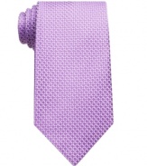 Adding some visual depth to a monochromatic tie, this printed pattern easily complements a solid tailored shirt.