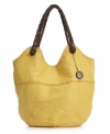 The Sak contrasts the rich leather body on their hold-it-all Indio Leather tote with tactile, woven handles.