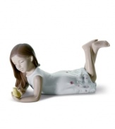 A little girl plays mother hen to a fuzzy yellow chick in a Lladro figurine that's undeniably sweet. A special gift for young ladies and cute addition to any porcelain collection.