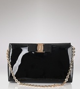 A signature grosgrain bow lends polished sophistication to Salvatore Ferragamo's glossy patent leather mini bag.